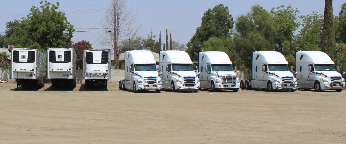 Commercial trucks on highway driving freight for business logistics